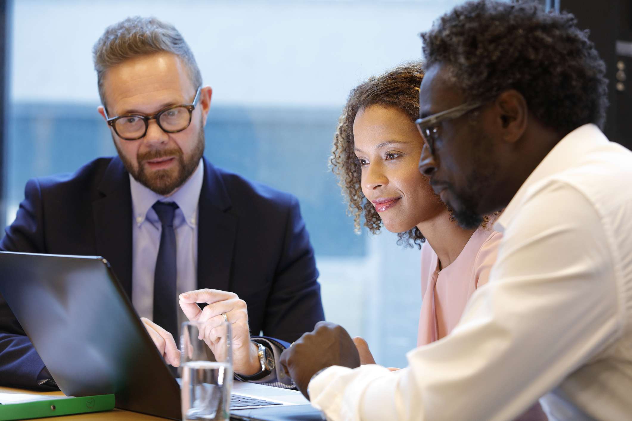 financial-advisor-having-a-meeting-with-clients-1063753064-c799ed7b34b945e79e548b62e90fdd83